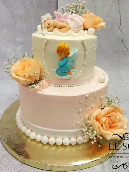I was so happy to make this baptism cake for baby Renée. This 3 kg two-tier Lemon Blueberry Cream Cheese cake features a delicate sleeping baby figurine, an angel plaque, and is adorned with fresh peach roses and baby's breath.