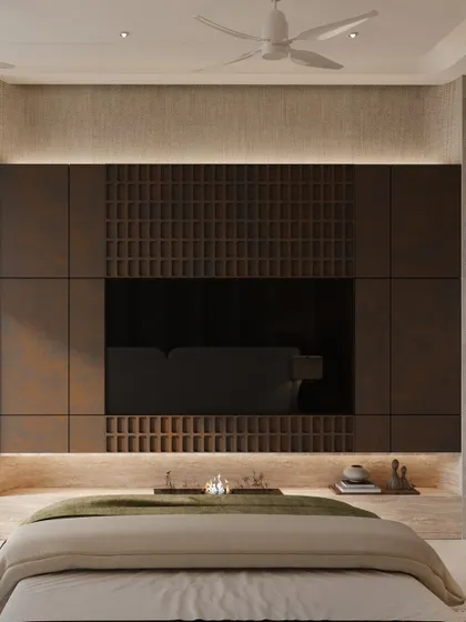 The view from the bed, showcasing the impressive, full-height media wall. The design uses rich materials to create a space that feels both opulent and harmonious.