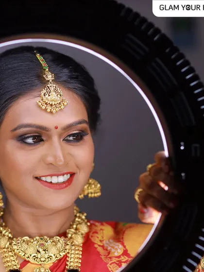 A close-up of this bride's sheer elegance. The ring light shows the detail and precision of the makeup, highlighting her features and creating a radiant glow.