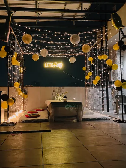 The "Lets Party" neon sign serves as a perfect photo backdrop for guests.
