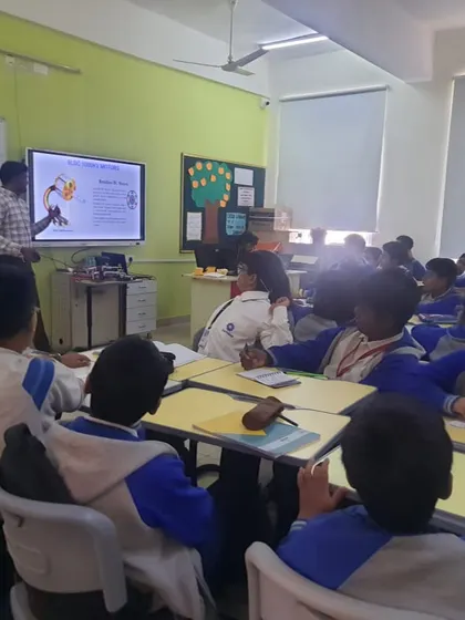 An instructor leads a class on drone technology at Euro International School, using a presentation to explain the core concepts before the hands-on session.