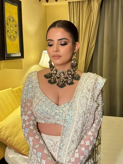 A detailed shot of the duochromatic smokey eyes I created for this reception look. The blend of colors creates a beautiful, multi-dimensional effect that is perfect for an evening event.