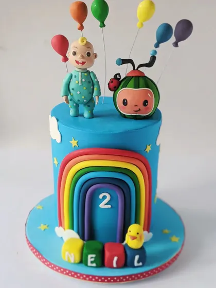 This Cocomelon cake was for Neil's second birthday, featuring a bright rainbow and JJ with his balloon. I've been making his cakes since his first birthday!
