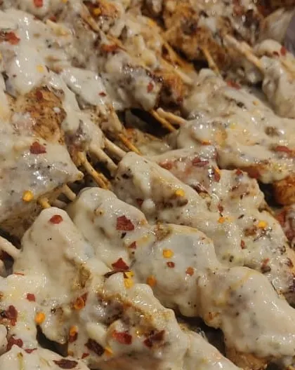 For the cheese lovers, my Malai Cheese Sticks are a must-try. These chicken skewers are grilled and then generously topped with a creamy cheese sauce and a sprinkle of chilli flakes for a little kick.