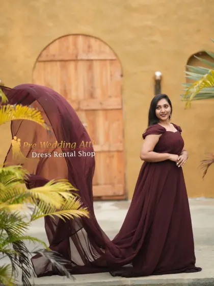 The maroon chiffon flying gown is shown here catching the breeze, demonstrating the beautiful transparency and movement of the fabric.