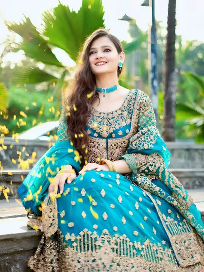 A beautiful shot with falling petals, adding a touch of magic and celebration to the festive look.