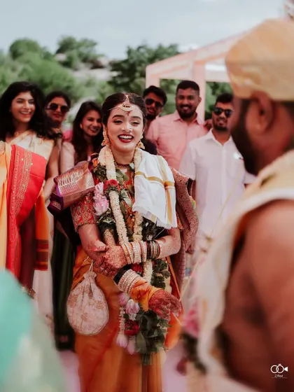 A duplicate of the bride's joyful reaction upon seeing her groom.
