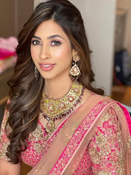 I created these soft, voluminous waves for a wedding ceremony. The hair is pulled back gently from the face to highlight the bride's features and jewelry.