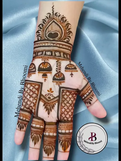 This design is all about the jhumkas! I've created a pattern with hanging bells and a Swastik symbol, combining traditional elements for a unique and auspicious look.