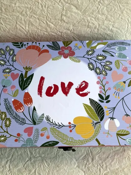 A top view of the "love" themed jewelry box, perfect for a wedding or anniversary gift.