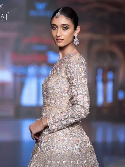 A close-up of the tail gown, showcasing the intricate cutwork and hand embellishments that make it a true showstopper.