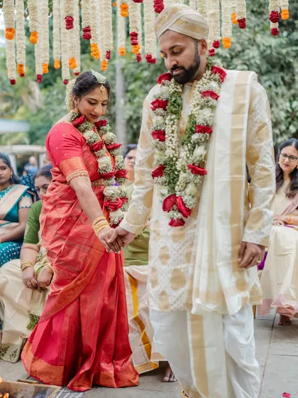 A fun and playful moment where the bride lifts the groom. We love capturing the unique personalities and humor of our couples, showing that weddings are all about joy.