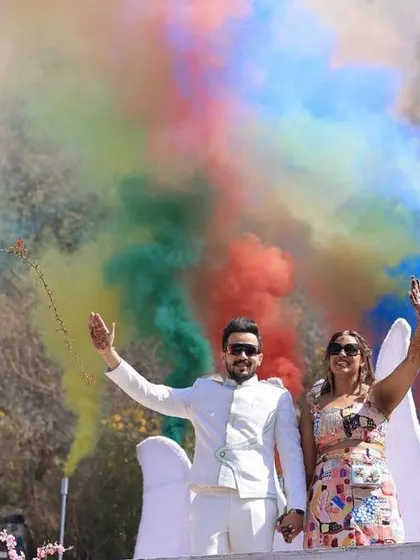 Waving to their guests from their carnival float. We design these entries to be interactive and fun for both the couple and everyone watching.