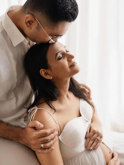 Such a sweet and loving gesture. A kiss on the forehead is one of my favorite prompts for couples. It creates such a natural and emotional moment, perfect for a maternity photoshoot.