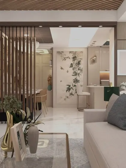 An open-concept living area where a wooden slat partition elegantly divides the dining space without closing it off. The design uses a soft, neutral color palette and natural textures to create a bright and airy environment perfect for a modern family home.