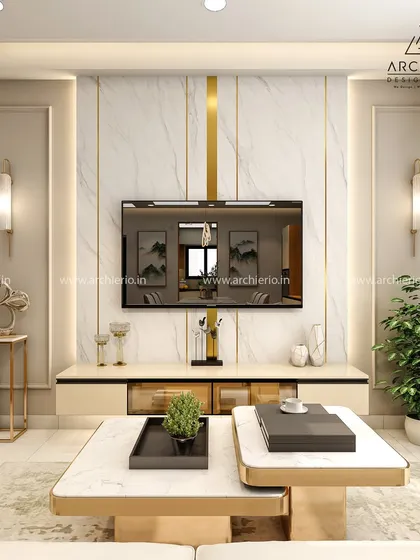 A luxurious TV unit design featuring a marble-finish wall with gold inlay. The elegant wall sconces and minimalist console create a look of refined sophistication.