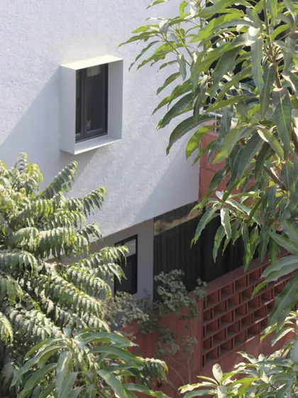 The interplay between the building and nature is central to our philosophy. Here, the clean architectural lines of the Jaipur House are softened by the surrounding greenery.