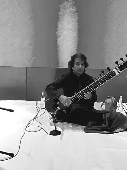 A black and white trio performance shot.