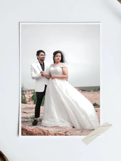 A full-length portrait of the couple at their Gandikota pre-wedding shoot, with the bride's white gown contrasting beautifully against the ancient fort ruins.