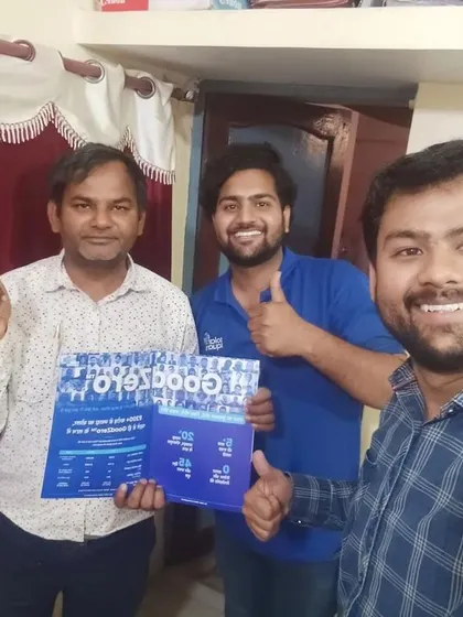 Our team with a customer, all thumbs-up for solar.