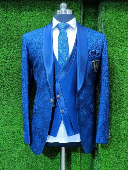A royal blue tuxedo in a textured fabric, displayed on a mannequin in our store.