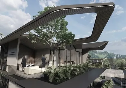 The rooftop terrace of a home in the Dona Paula Masterplan. The expressive, shifting roof form creates a large opening to the sky, framing views and providing a semi-sheltered outdoor space for enjoying the sea breeze.