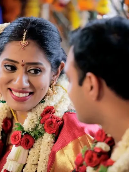 A beautiful candid shot of the bride smiling at her groom during the ceremony. Her expression of love and happiness is what makes this photo so special.