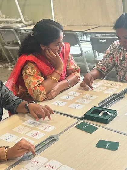 More teachers at CS Academy engrossed in the Yonjuu game. The session is designed to be a fun, low-pressure way to explore complex mathematical ideas.