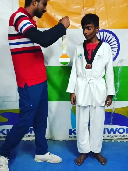 The moment I award a medal to one of my hardworking students.