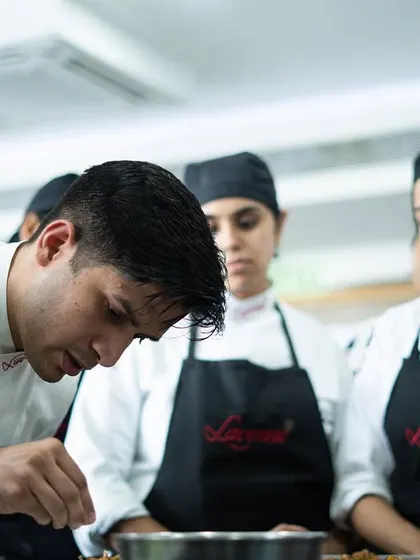 Intense focus during a practical session. Our diploma courses provide in-depth, professional training for those serious about a career in pastry.