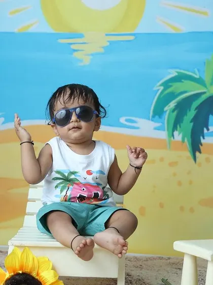 Another confident pose from the little model during his fun beach-themed session.