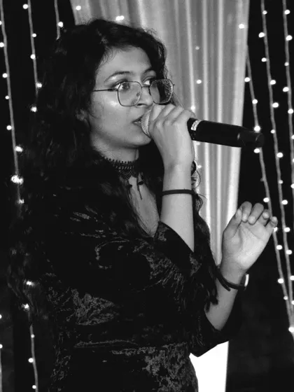 A duplicate of a focused black and white performance shot. This mood is great for creating a sophisticated and artistic ambiance at corporate functions or elegant parties.