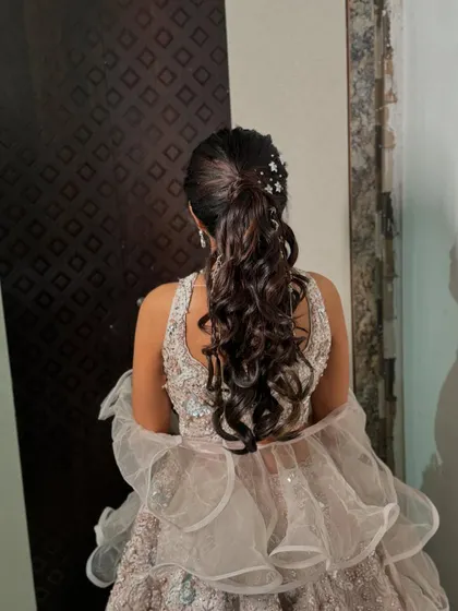 This hairstyle is perfect for a night of dancing, keeping the hair stylishly out of the way while still making a statement.