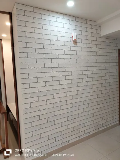 A white brick wallpaper, perfect for a clean, modern, and subtly rustic look in a hallway.