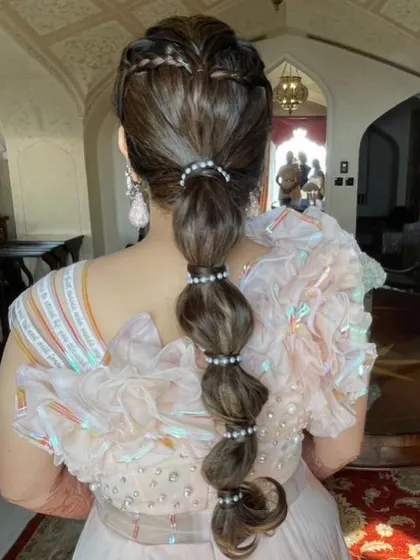 The full view of this stunning and unique bridal braid. It's a great way to keep your hair managed while still having a major style moment.