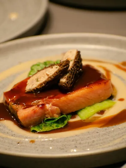 A special creation for an event: salmon served with morel mushrooms and a rich jus, showcasing our ability to create bespoke fine dining experiences.