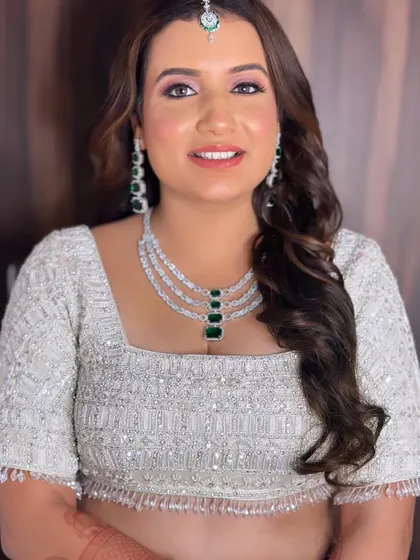 A close-up without the veil, showing off the beautiful soft waves and the fresh, glowing makeup.