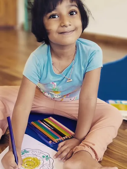 The happy face of a young artist after our Mother's Day yoga and art session. Combining mindfulness with creativity is a wonderful experience for children.