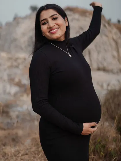 A happy and carefree moment from an outdoor maternity shoot. The makeup is simple and fresh, designed to feel lightweight and comfortable while still looking polished on camera.