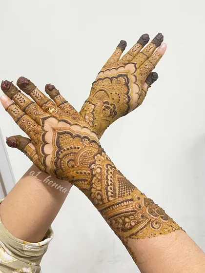 A stunning pose showing a full and intricate design on both hands.