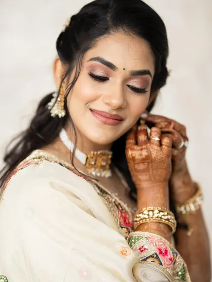 A candid moment as she puts on her earrings.