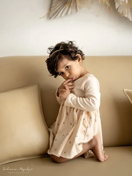 Another shot of the little girl who was told "no sugar." Her shy, coy expression is absolutely adorable and full of personality.