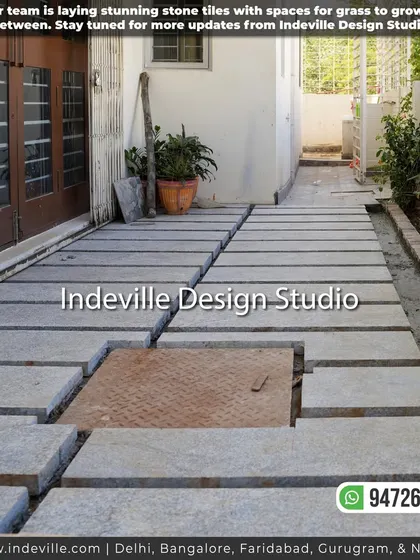 A work-in-progress shot of a backyard pathway. My team is laying stunning stone tiles with spaces left for grass to grow in between, a technique that blends hardscaping and softscaping beautifully.
