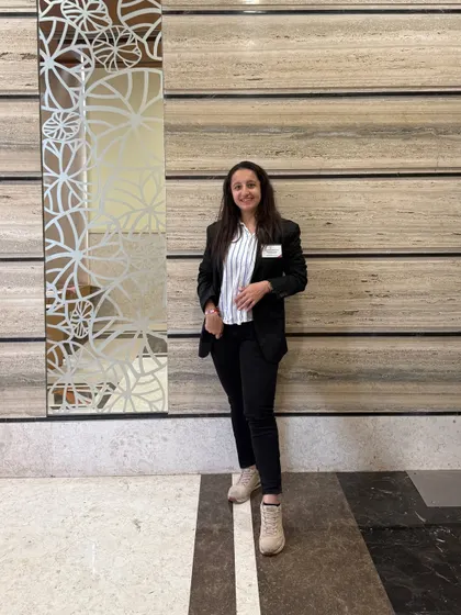 A smiling, confident pose in my professional attire. I bring the same energy to my business as I do to my dance.