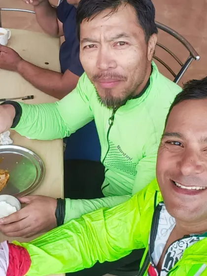 Sharing a meal and a smile. These moments of camaraderie are what make the grueling hours on the saddle worthwhile.