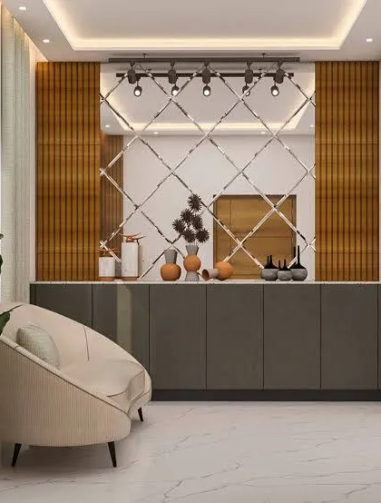 This foyer uses a large, diamond-patterned mirror to make the space feel bigger and brighter. The simple grey console provides storage, and the armchair creates a cozy waiting spot.