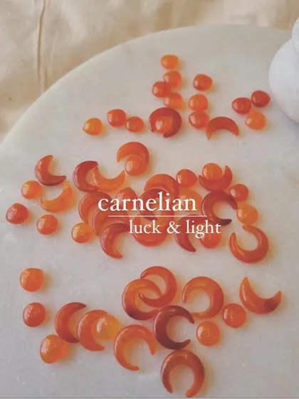 Two crystals for luck. Peach Moonstone brings good fortune in love, while Carnelian manifests prosperity and light.