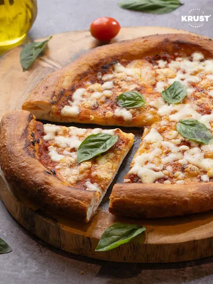 A beautiful shot of a classic Margherita pizza, used to promote our May pizza topping workshop. It shows the delicious potential of simple, quality ingredients.