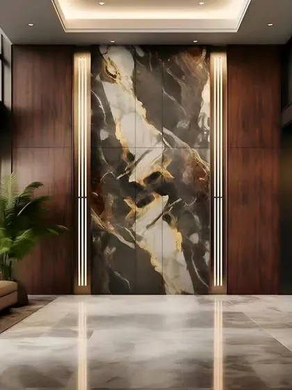 A grand lobby design featuring a dramatic, book-matched marble wall flanked by backlit panels and dark wood.