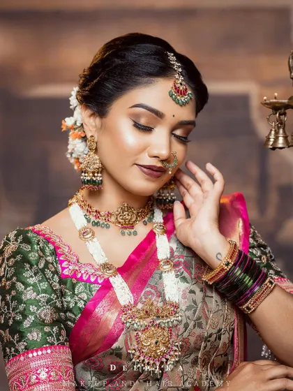 The soft makeup and elegant pose perfectly complement the modern aesthetic of this floral saree.